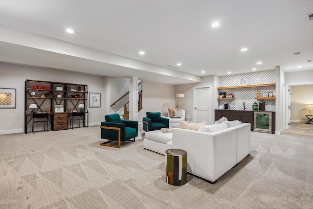 carpeted living room with wet bar and beverage cooler