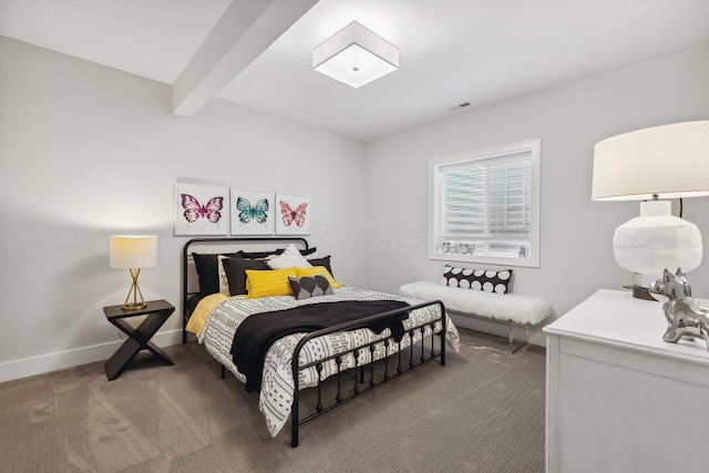 carpeted bedroom with beam ceiling