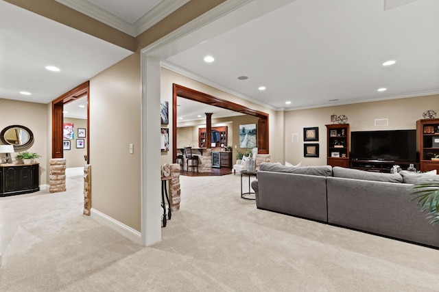 carpeted living room with crown molding