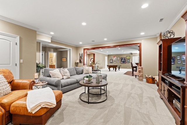 carpeted living room with ornamental molding