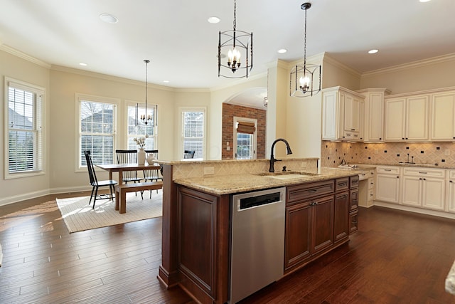 kitchen featuring pendant lighting, a chandelier, dark hardwood / wood-style floors, and dishwasher