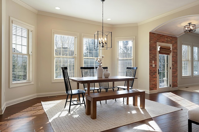 dining space featuring a healthy amount of sunlight and a chandelier