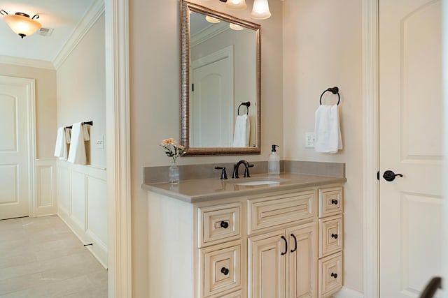 bathroom featuring vanity and crown molding