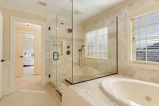 bathroom featuring tile patterned flooring, crown molding, shower with separate bathtub, and a wealth of natural light