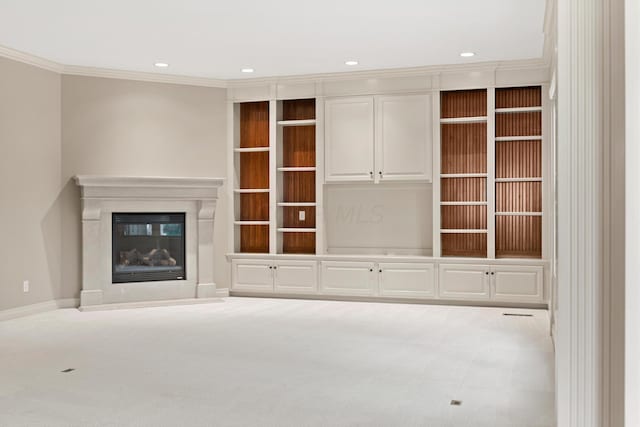 unfurnished living room with light colored carpet and crown molding