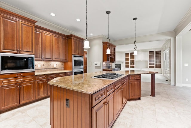 kitchen featuring decorative light fixtures, a center island, stainless steel appliances, and tasteful backsplash