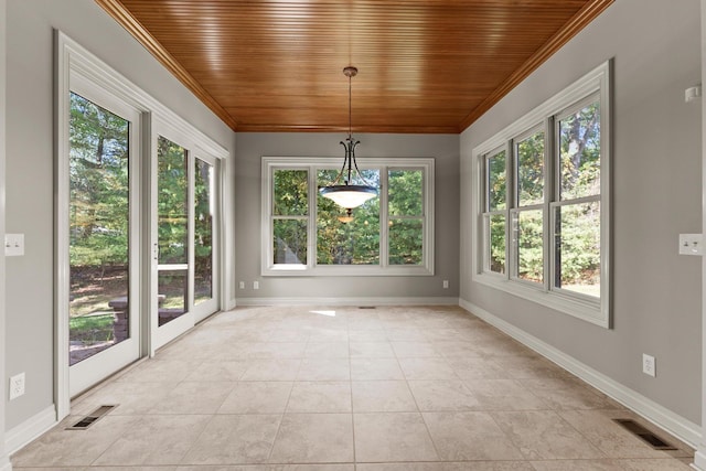 unfurnished sunroom with wooden ceiling