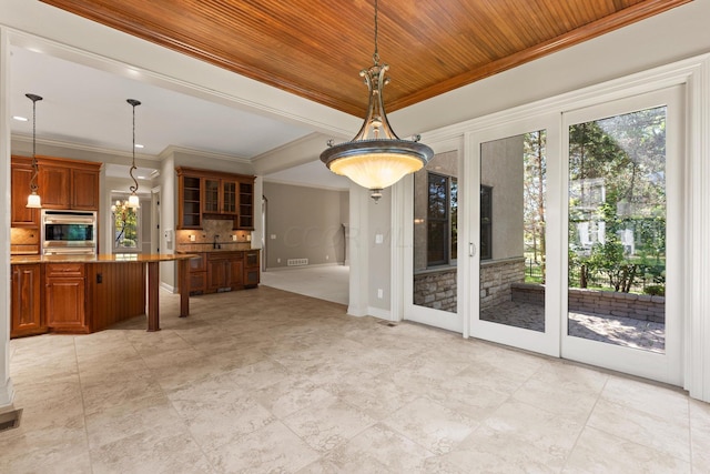 unfurnished dining area featuring sink, wooden ceiling, crown molding, and french doors