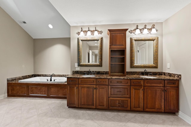 bathroom with vanity and a washtub