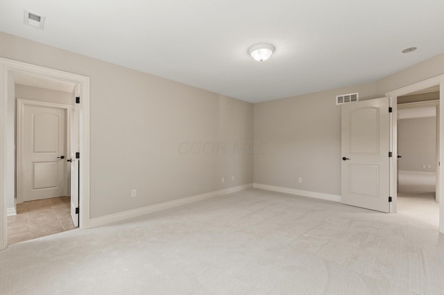 unfurnished bedroom with light colored carpet