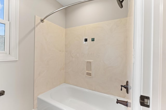 bathroom with shower / tub combination