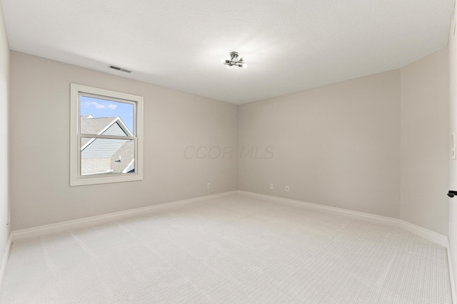 spare room with carpet