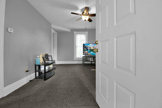 sitting room featuring ceiling fan