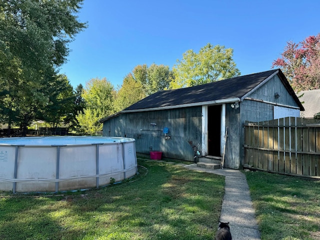 view of outbuilding with a yard