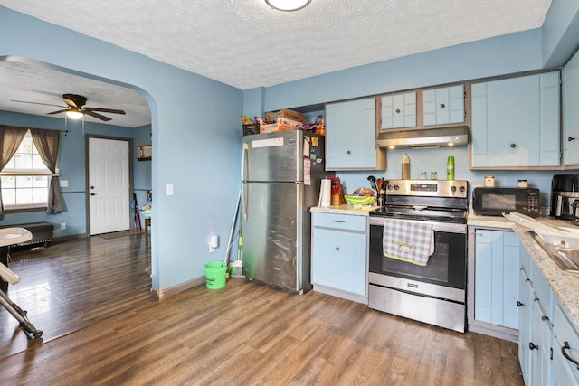 kitchen featuring ceiling fan, dark hardwood / wood-style flooring, a textured ceiling, and appliances with stainless steel finishes