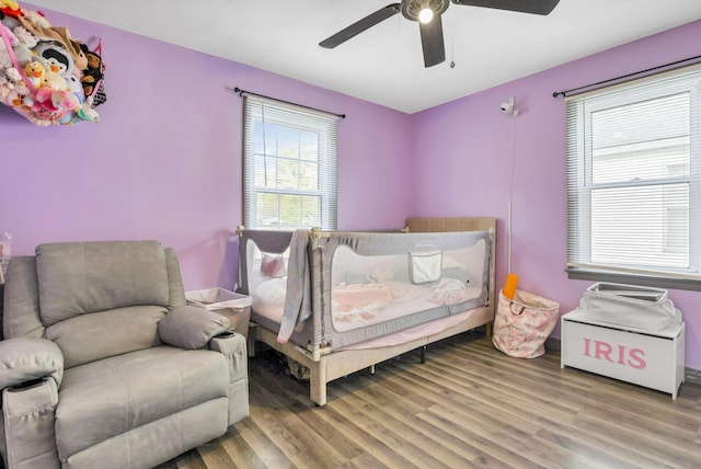 bedroom featuring ceiling fan and wood-type flooring