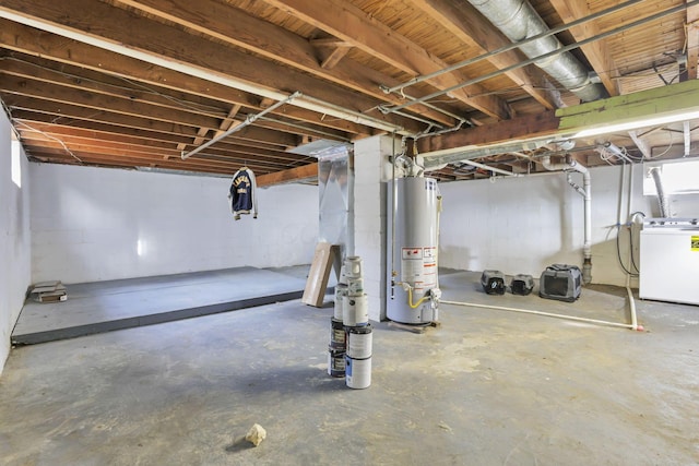 basement featuring washer / dryer and water heater