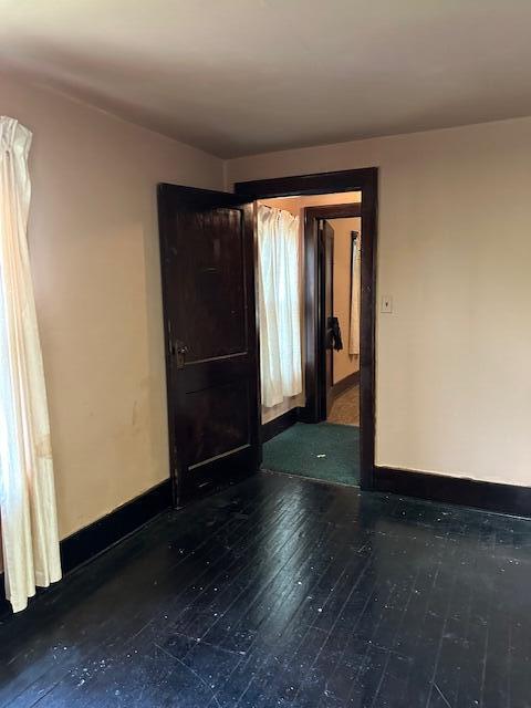 empty room featuring dark hardwood / wood-style floors