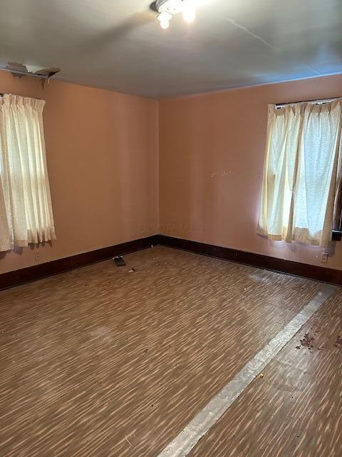 empty room with wood-type flooring