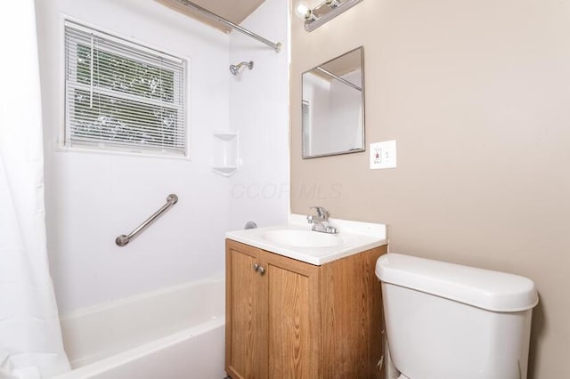 full bathroom with vanity, toilet, and shower / bath combo with shower curtain