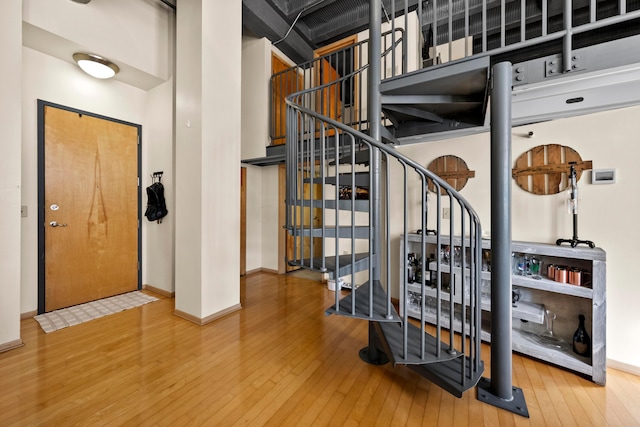 stairway featuring hardwood / wood-style floors