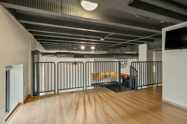 basement featuring hardwood / wood-style flooring