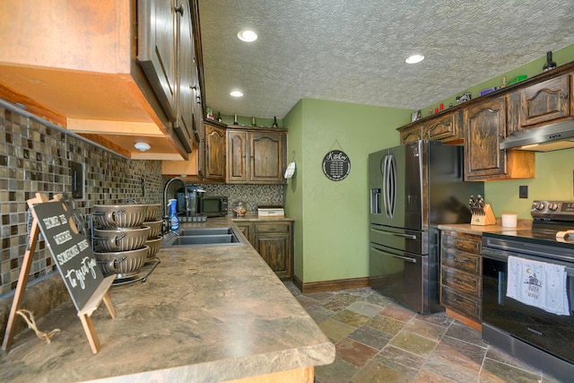 kitchen featuring stainless steel fridge, tasteful backsplash, ventilation hood, sink, and black electric range oven