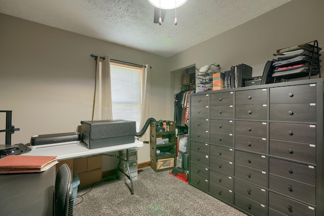 office with carpet flooring and a textured ceiling