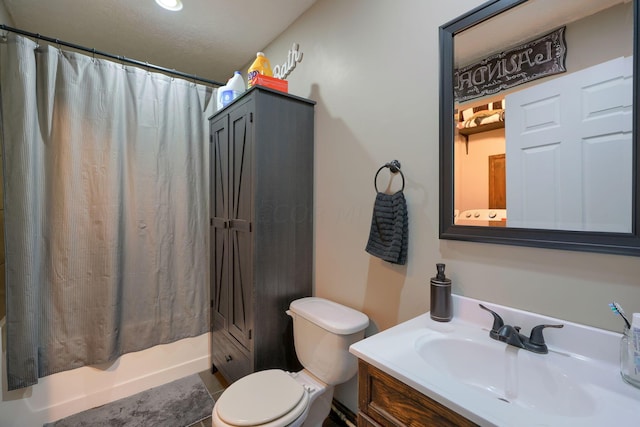 full bathroom featuring vanity, toilet, shower / bathtub combination with curtain, and a textured ceiling