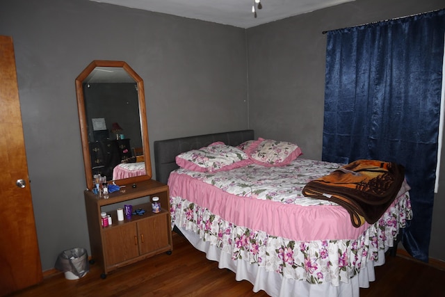 bedroom featuring wood-type flooring