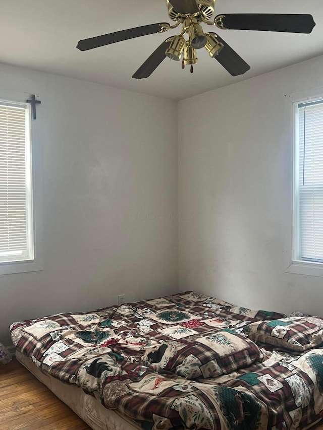 bedroom featuring light hardwood / wood-style floors and ceiling fan