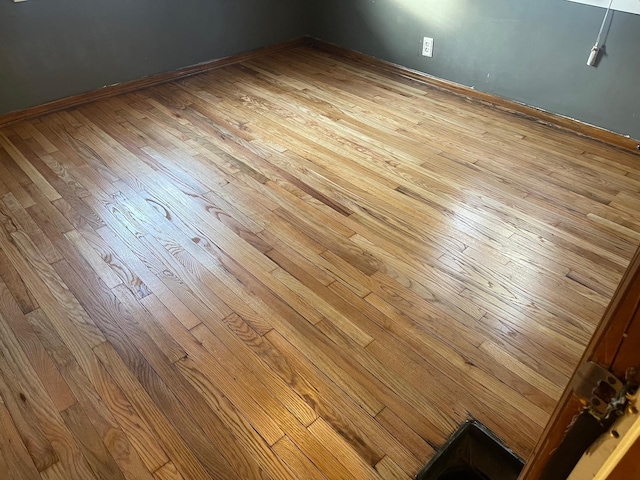 interior details featuring hardwood / wood-style flooring