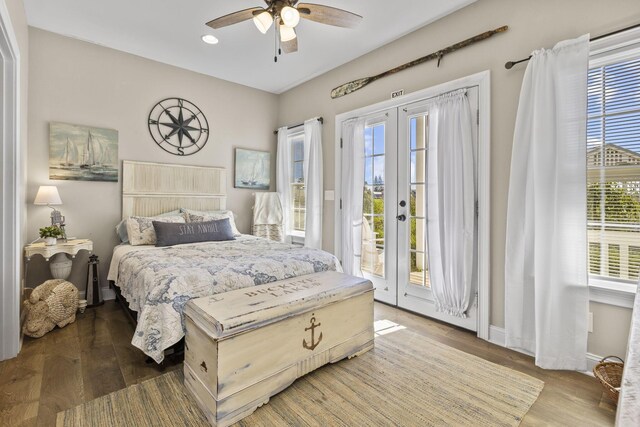 bedroom with access to exterior, french doors, dark hardwood / wood-style flooring, and ceiling fan