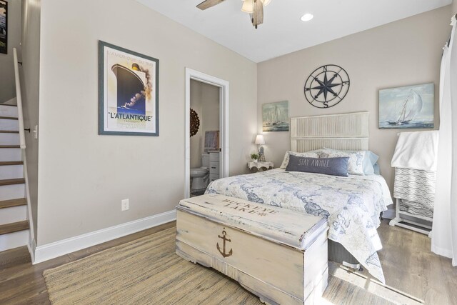 bedroom featuring ceiling fan, dark hardwood / wood-style flooring, and ensuite bath