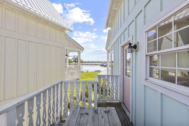 deck featuring a water view