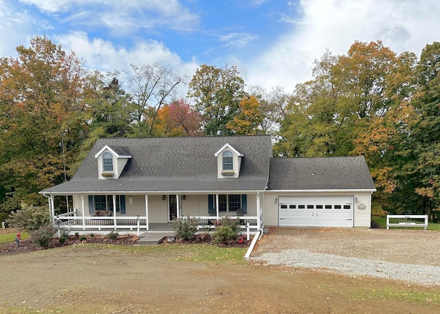 new england style home featuring a garage