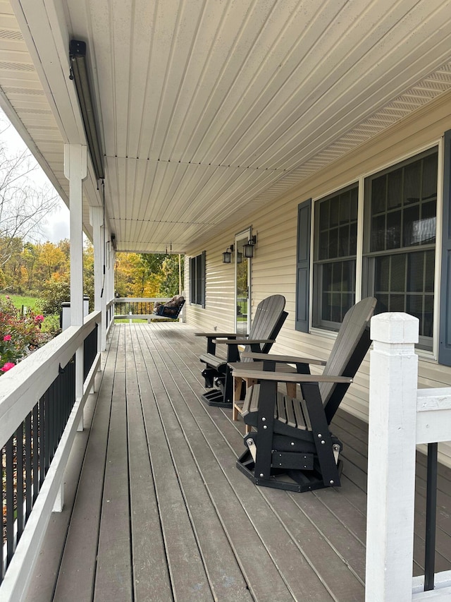 wooden terrace featuring a porch