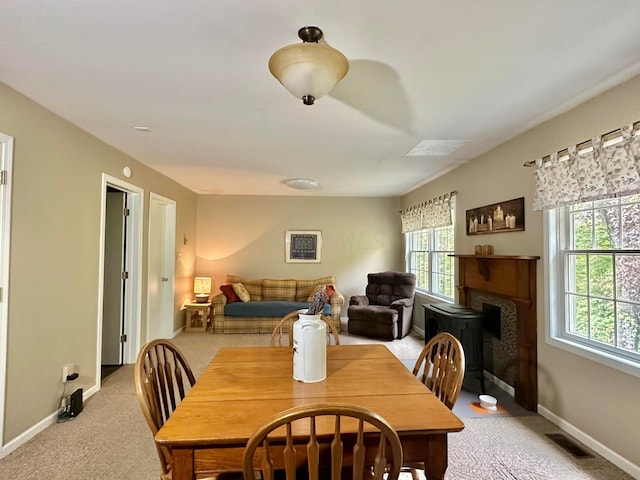 dining room featuring light colored carpet