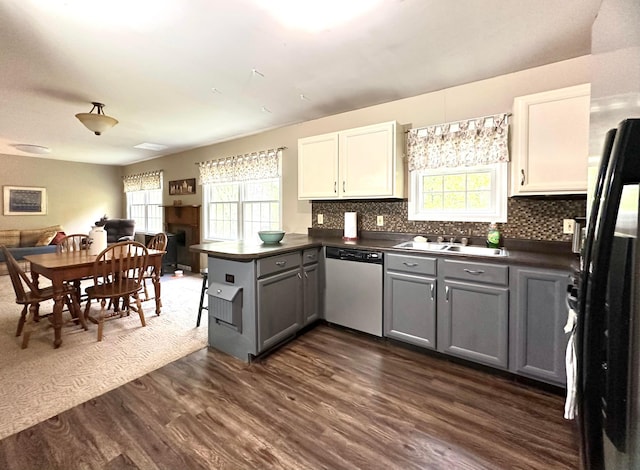 kitchen featuring dishwasher, gray cabinets, kitchen peninsula, and white cabinetry