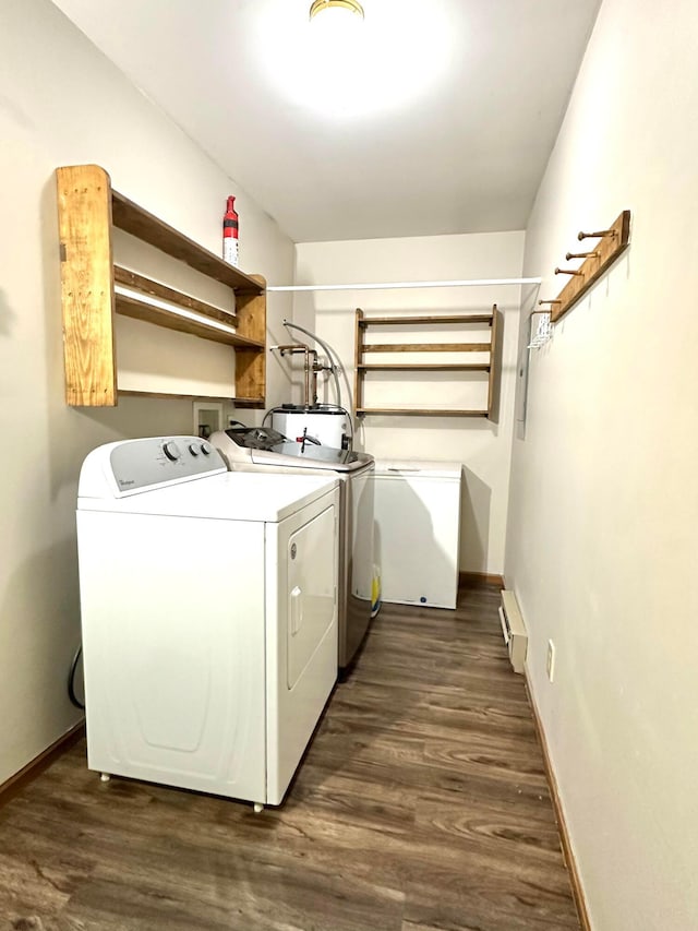 washroom with baseboard heating, dark wood-type flooring, and independent washer and dryer