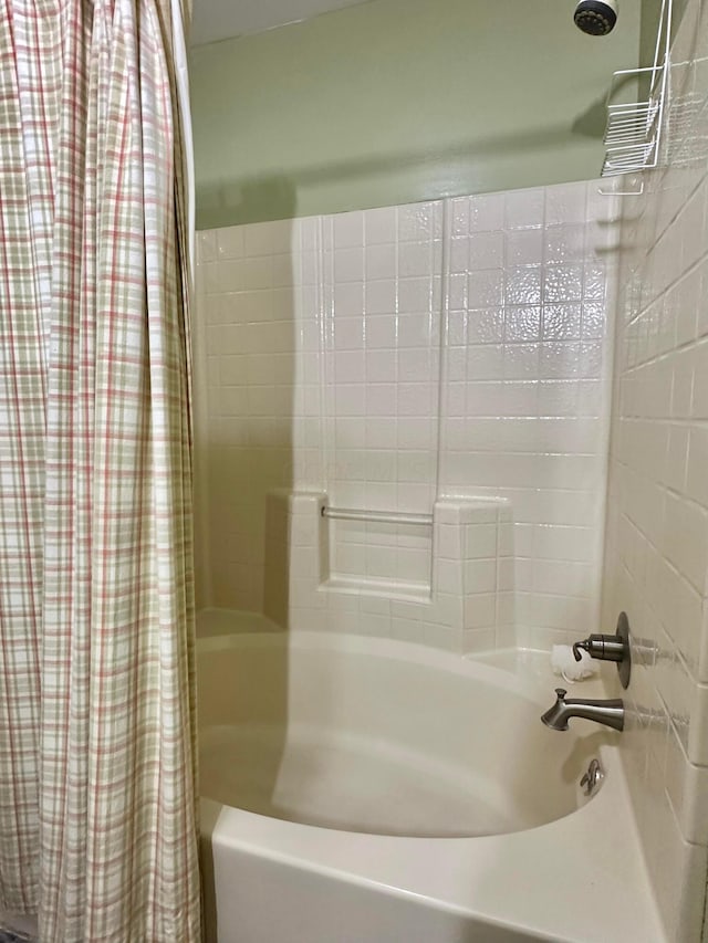 bathroom featuring shower / bath combo with shower curtain