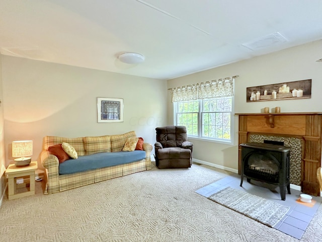 living room featuring carpet flooring and a wood stove