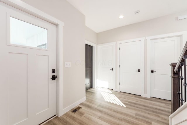 foyer entrance featuring light hardwood / wood-style flooring