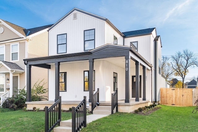 modern inspired farmhouse featuring a front lawn