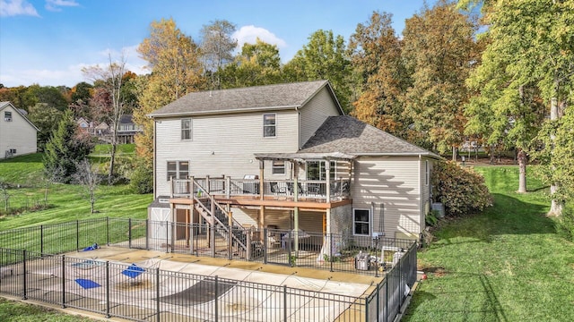 rear view of house with a lawn, a pergola, a swimming pool side deck, and a patio area