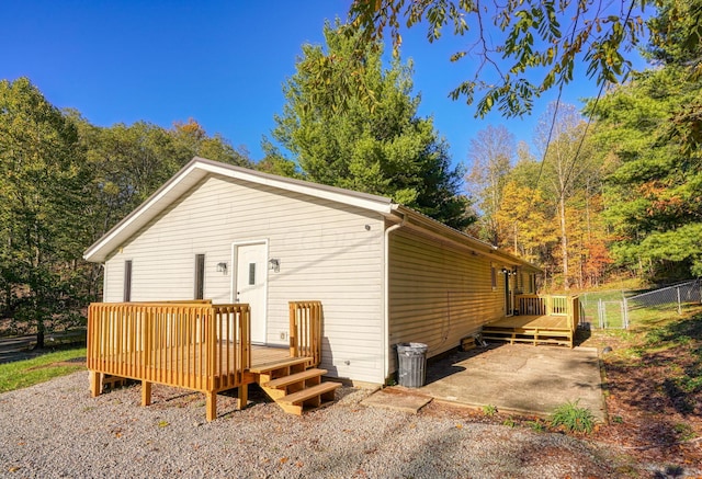 rear view of property with a wooden deck