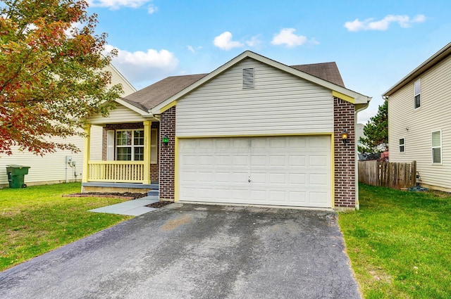 view of front of property with a garage and a front lawn