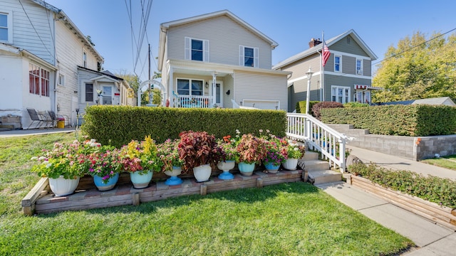 view of property with a front lawn