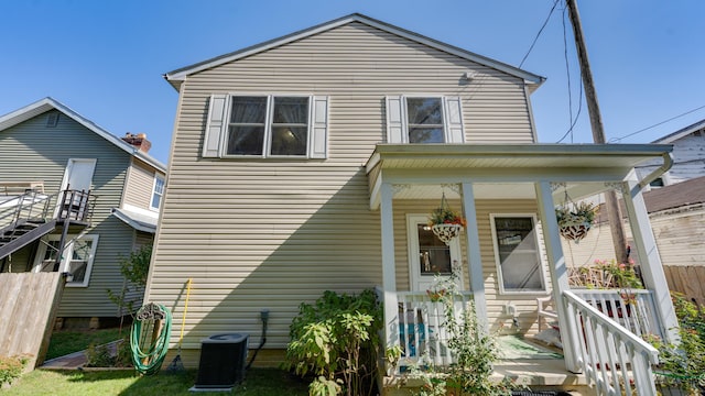 view of front of property featuring central air condition unit and covered porch