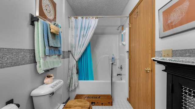 full bathroom featuring vanity, toilet, shower / bathtub combination with curtain, and a textured ceiling